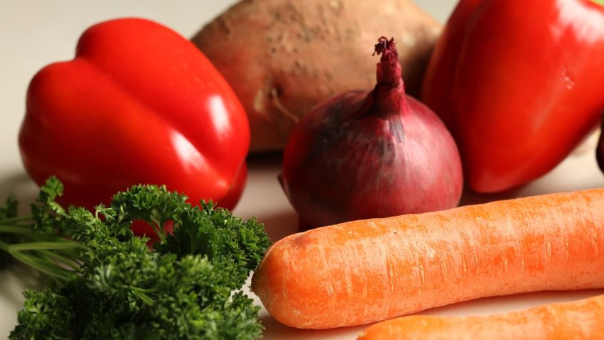 Broccoli, 2 carrots, a red onion, two red peppers, and a potato.