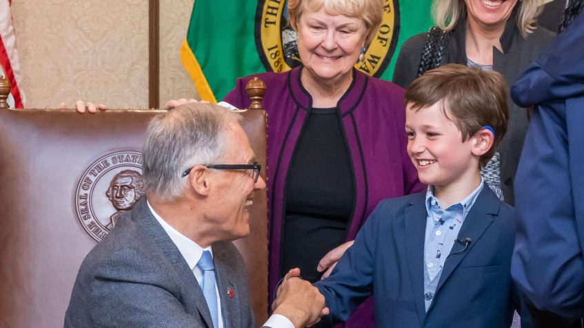 Gov. Inslee signs Engrossed Substitute House Bill No. 1222, May 04, 2023. Relating to requiring coverage for hearing instruments. Primary Sponsor: Rep. Orwall