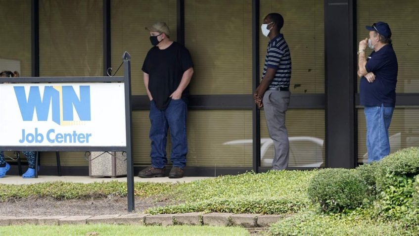 Clients line up outside the state Department of Employment Security WIN Job Center in Pearl, Mississippi. Many state lawmakers are seeking to help workers who are facing financial hardship because of the pandemic.