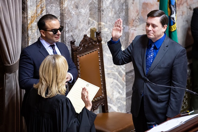 Sen. Stanford being sworn in by Justice Stephens and Lt. Governon Habib