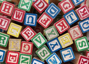 Multicolored toy alphabet blocks.