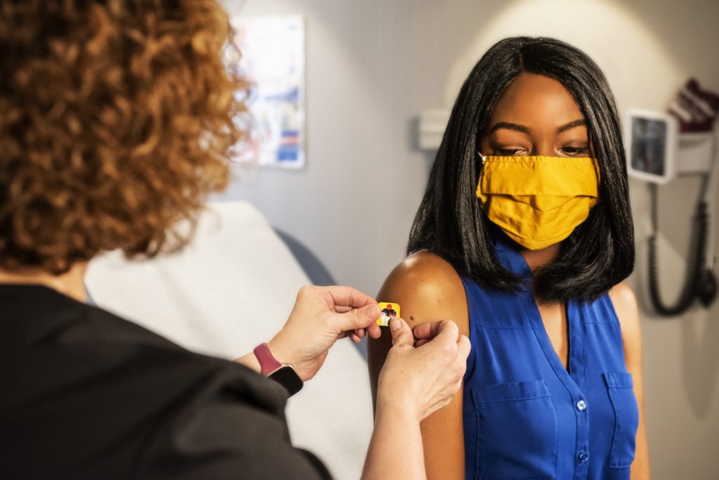 Photo of a woman receiving a vaccine.