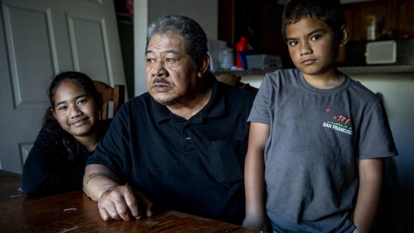 Uli Fuamaila, 73, and his twin 8-year-old grandkids Neamiah, right, and Naomi in their Federal Way home on June 3, 2019. Fuamaila raises the twins, along with his 2-year-old grandson. (Photo by Dorothy Edwards/Crosscut)
